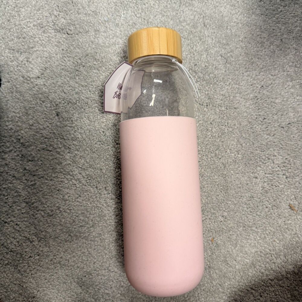 Glass Water bottler with pink silicone cover